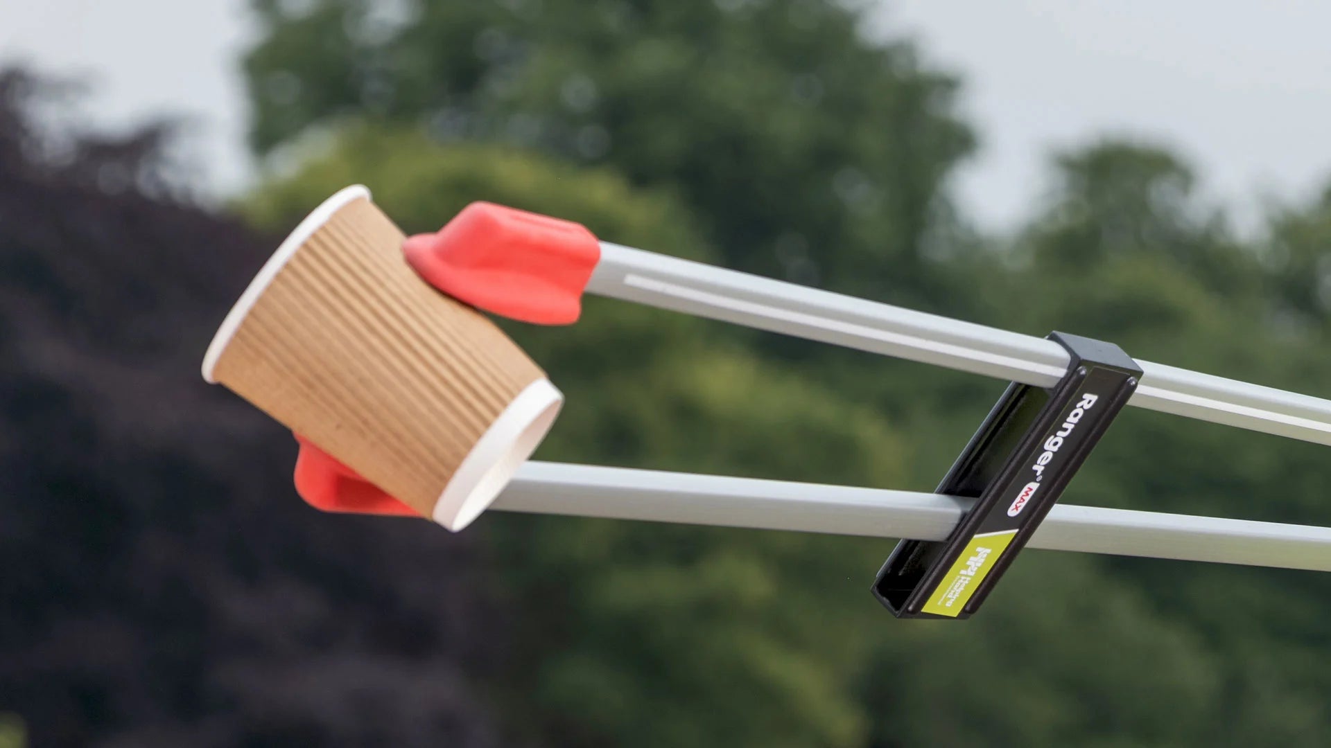 A Ranger Max litter picker grabbing a paper cup.