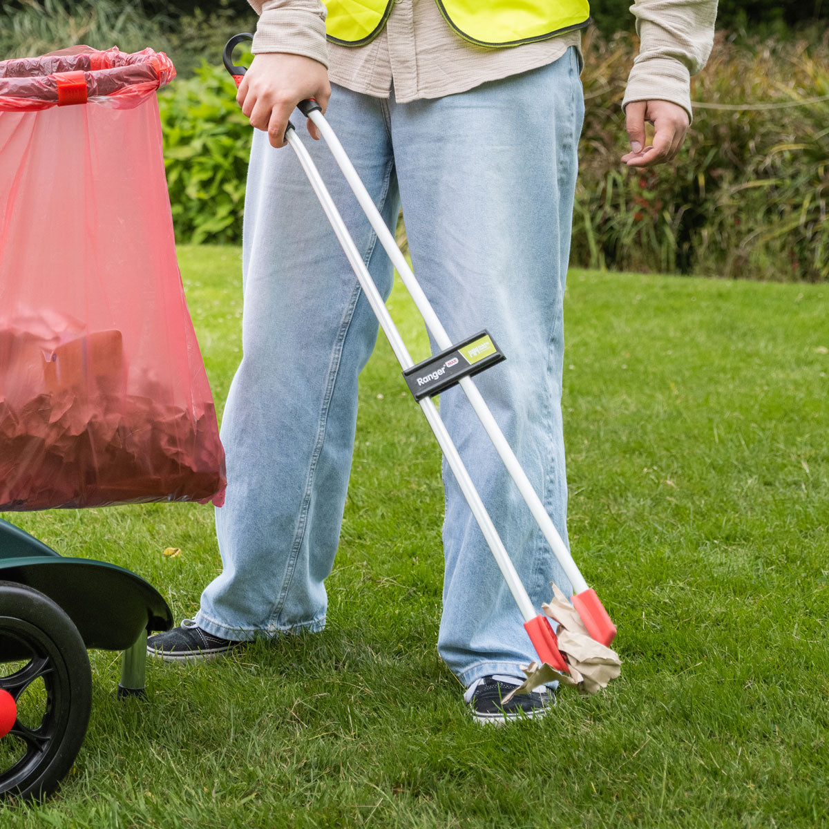 Person using Ranger Max Curved Heavy Duty Litter Picker.