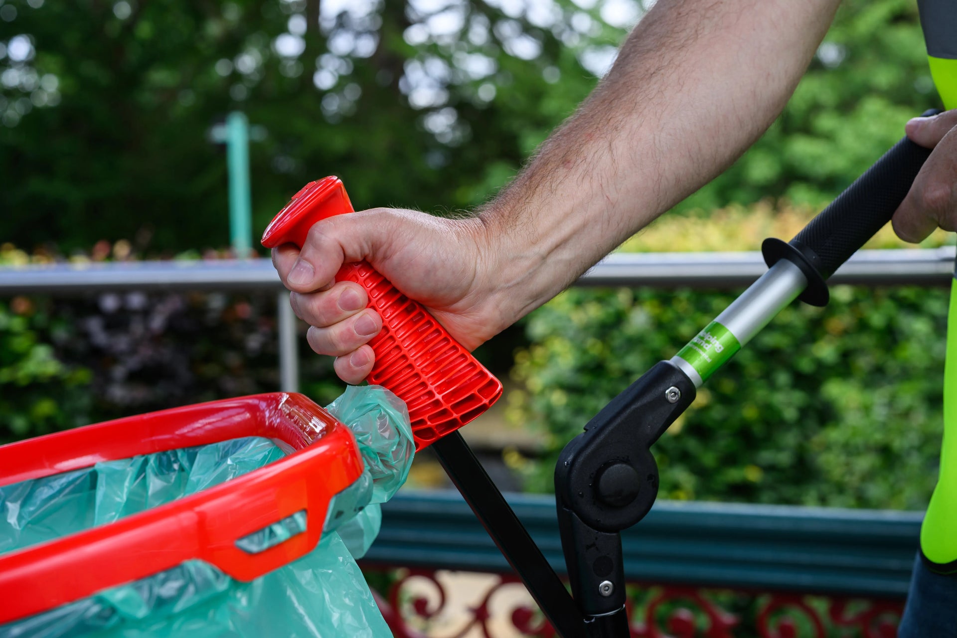 Someone placing a litter hoop onto a litter cart