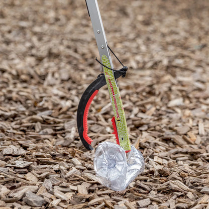 Graptor Kids litter picker grabbing plastic bottle.