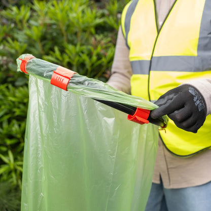 Volunteer holding Handi Hoop Clip Litter Hoop.