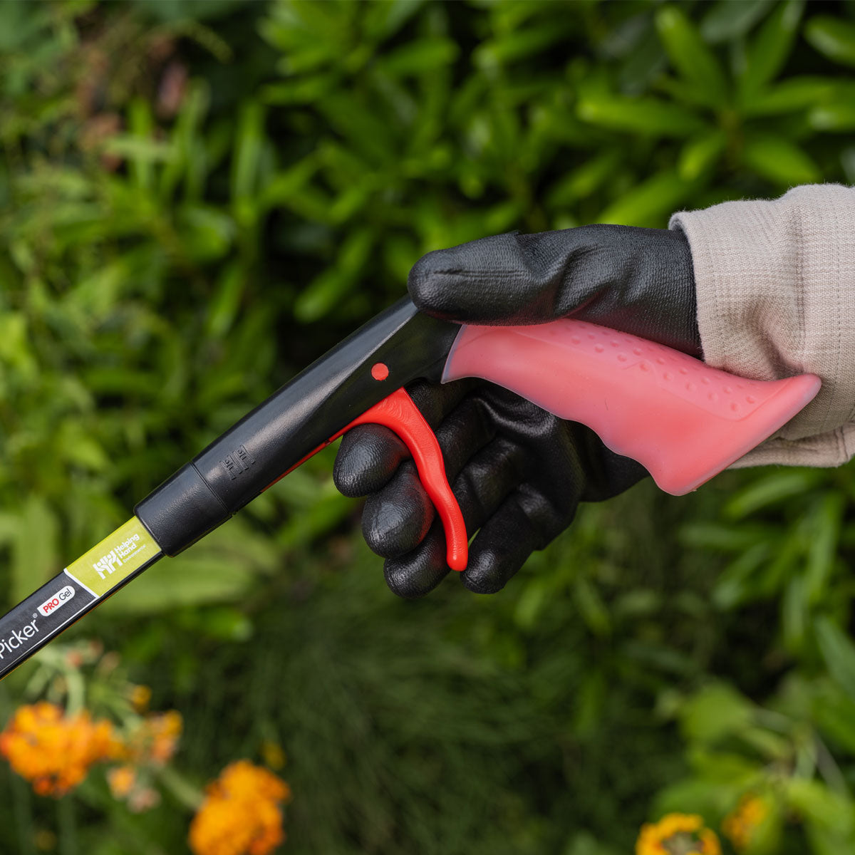 Hand grabbing Litter Picker Pro Gel Handle.