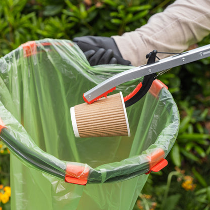 Person picking paper cup with Litterpicker Pro Gel.