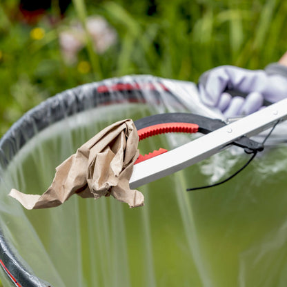 Person collecting paper rubbish using LitterPicker Pro.