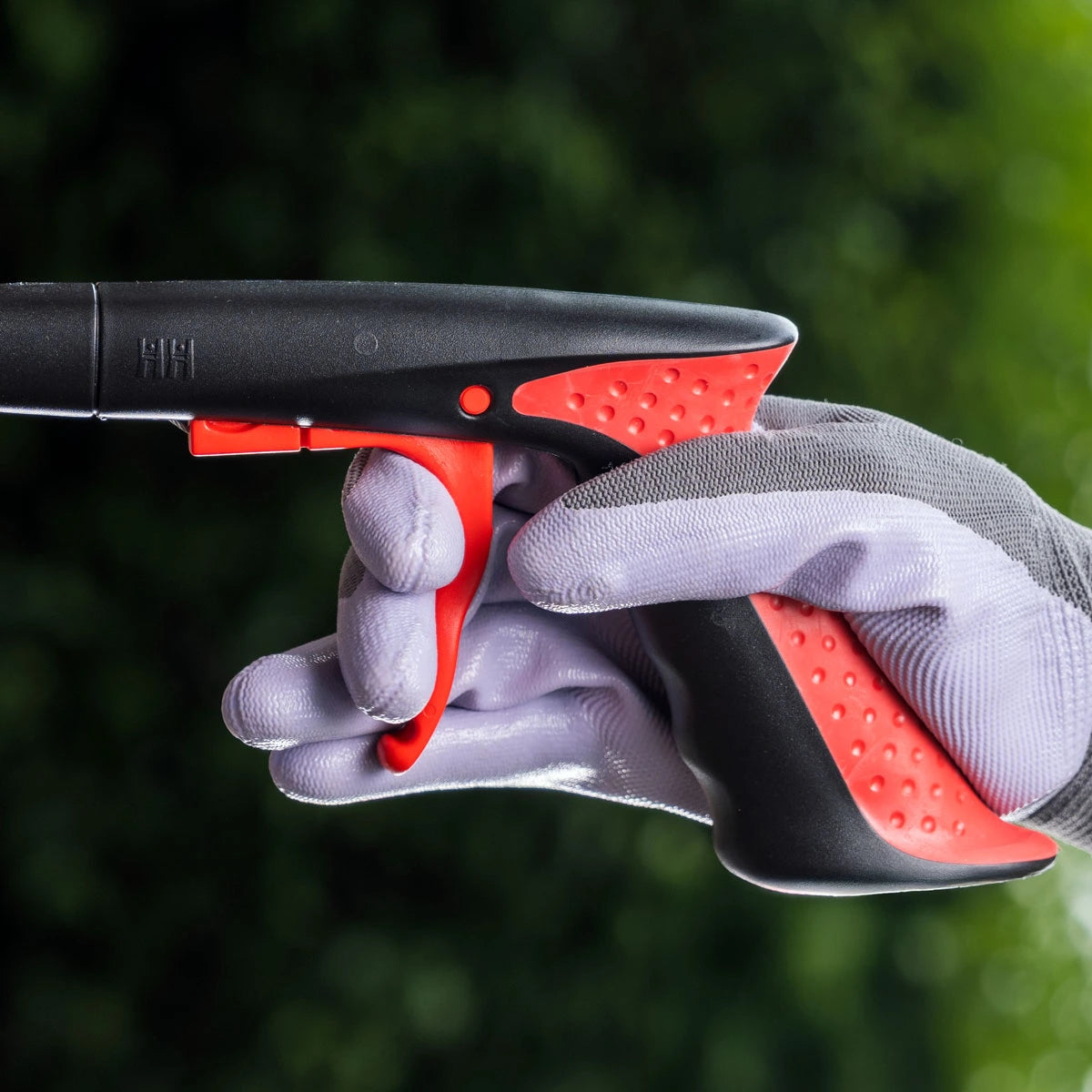 Person grabbing LitterPicker Pro handle.