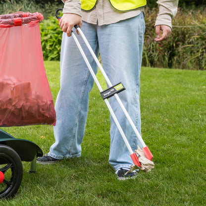Person using Ranger Max Curved Heavy Duty Litter Picker. 
