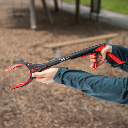 Person holding Tidy Jon Litter Picker.